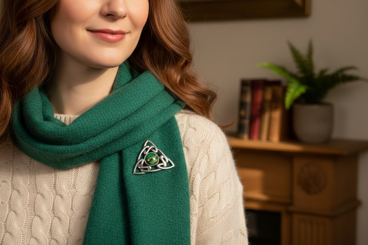 a woman wearing a Celtic brooch made in Scotland