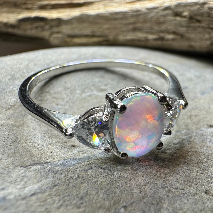 Opal ring on a stone surface with a natural background