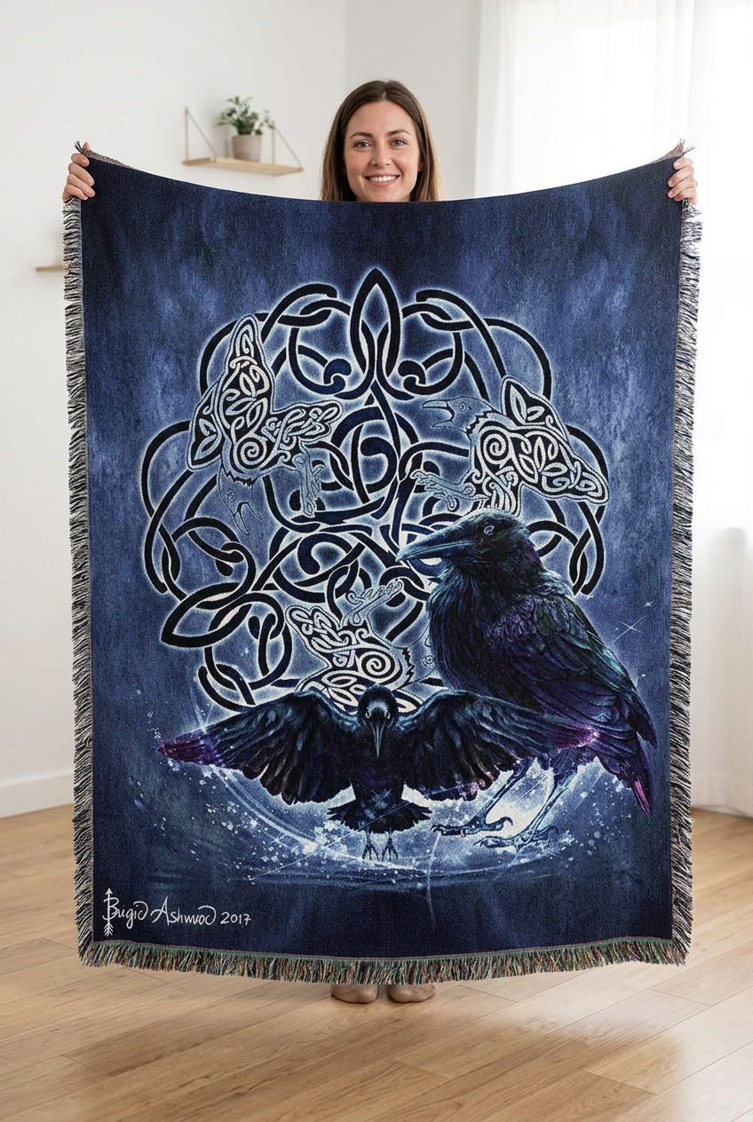 A square woven throw blanket with fringed edges, featuring a dark blue and black Celtic knot design with two raven birds in the center. The blanket is displayed flat against a solid white background.