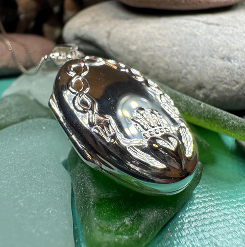 Load image into Gallery viewer, Oval Claddagh Locket Necklace in Sterling Silver
