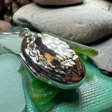 Load image into Gallery viewer, Oval Claddagh Locket Necklace in Sterling Silver
