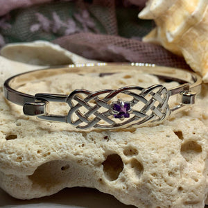 Solid sterling silver Celtic bangle bracelet with authentic amethyst stone. Celtic knot work bracelet crafted from sterling silver with a 1 carat square cut amethyst stone with deep purple color.