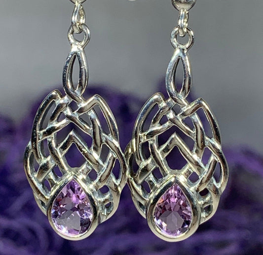Sterling Silver earrings features traditional Celtic designs symbolizing love and friendship. Perfect gift for Celtic heritage.