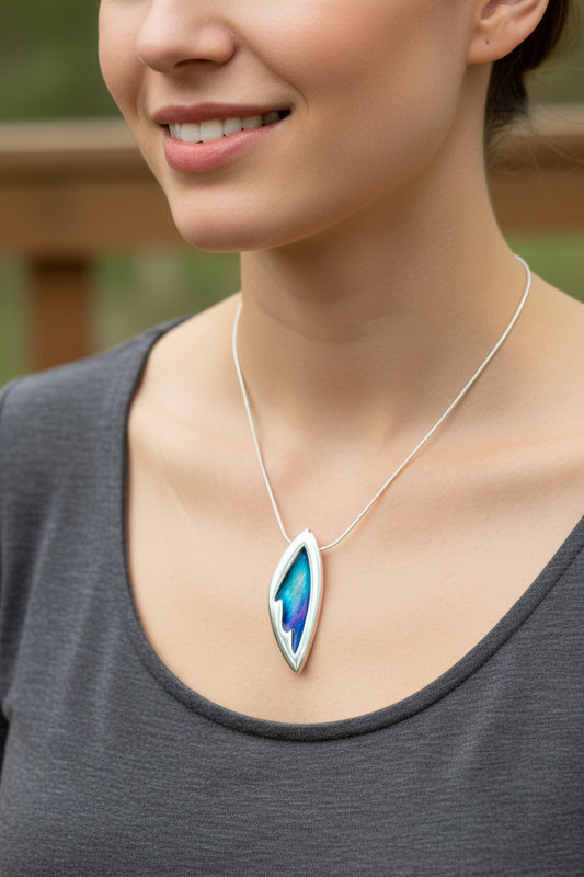 Sterling Silver Northern Lights Necklace is a reminder of the night sky spectacle as seen from the Scotland and other parts of the world. The colors of the northern lights are in enamel. Aurora Borealis pendant.