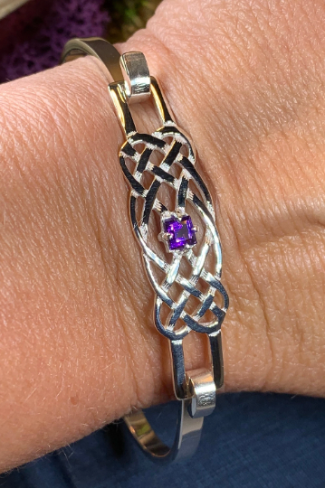 Solid sterling silver Celtic bangle bracelet with authentic amethyst stone. Celtic knot work bracelet crafted from sterling silver with a 1 carat square cut amethyst stone with deep purple color.