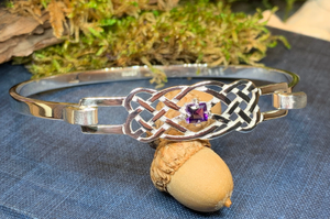 Solid sterling silver Celtic bangle bracelet with authentic amethyst stone. Celtic knot work bracelet crafted from sterling silver with a 1 carat square cut amethyst stone with deep purple color.